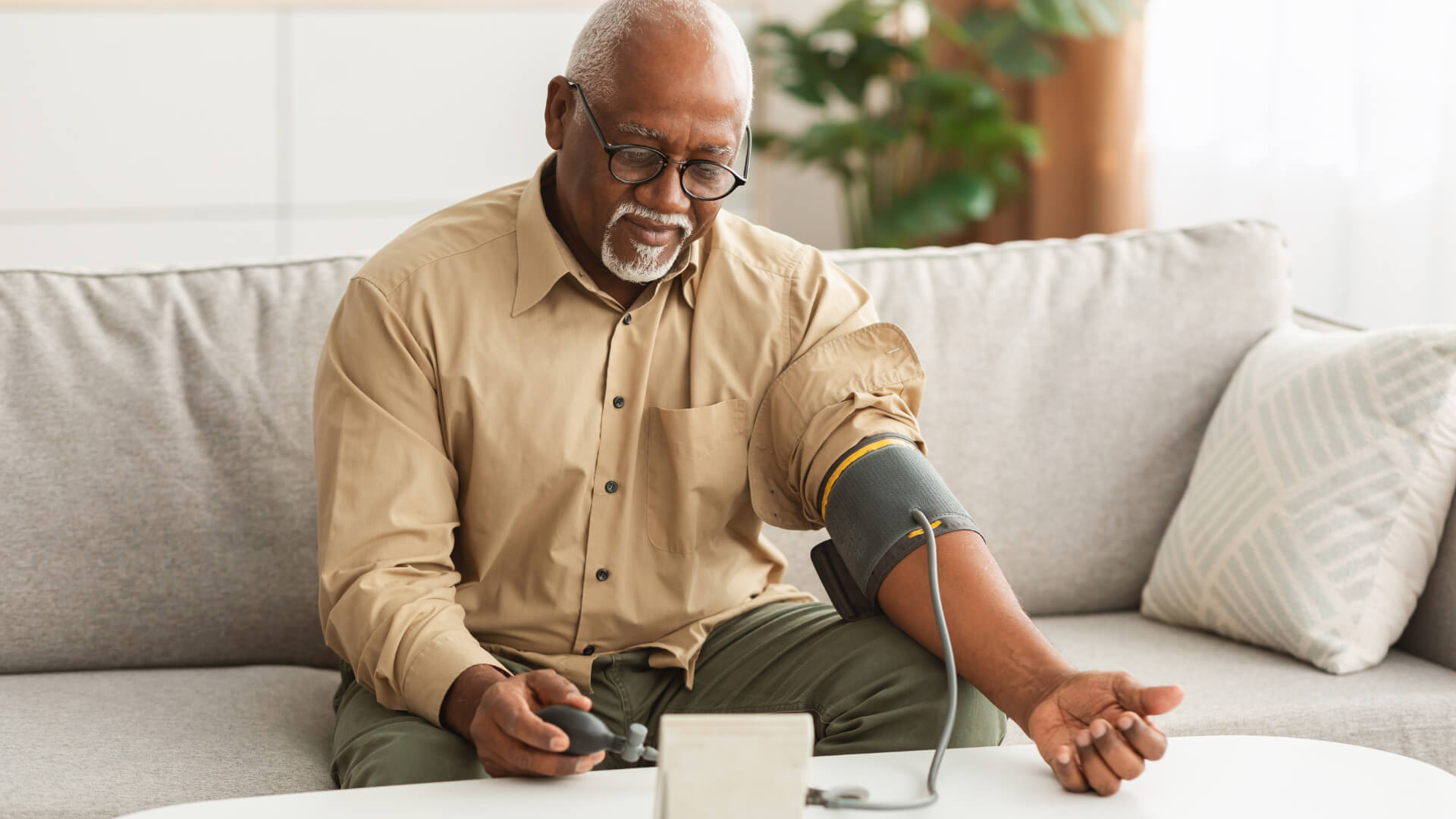 Grandpa Using Sphygmomanometer Image